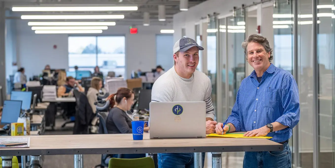 Men collaborating in office