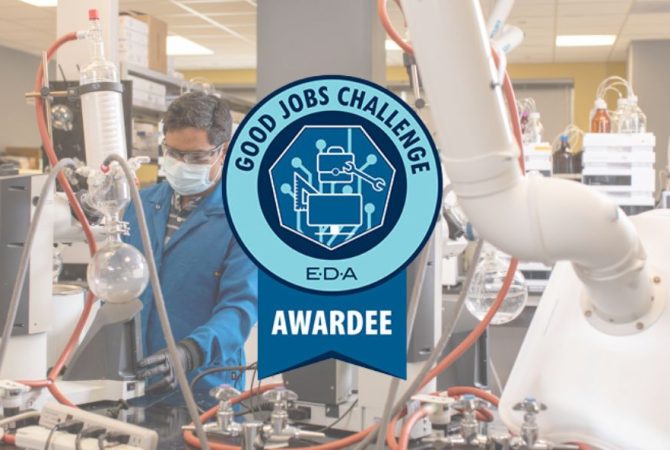 A scientist working in a laboratory with various equipment, representing the Richmond-Petersburg pharma effort that secured $4 million in federal funding under the Good Jobs Challenge initiative.