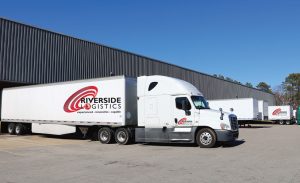 Riverside Logistics Trucks and Warehouse