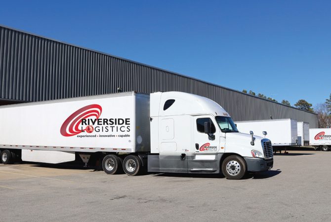 Riverside Logistics Trucks and Warehouse
