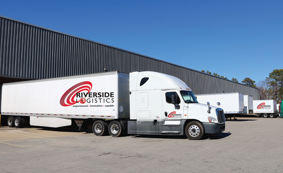 Riverside Logistics Trucks and Warehouse