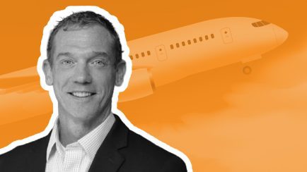 image of Jeff Wright, CEO Allianz Partners US on orange background