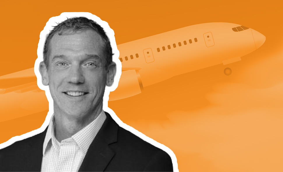image of Jeff Wright, CEO Allianz Partners US on orange background