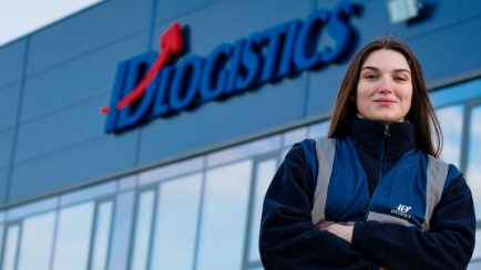 ID logistics woman in front of distribution center